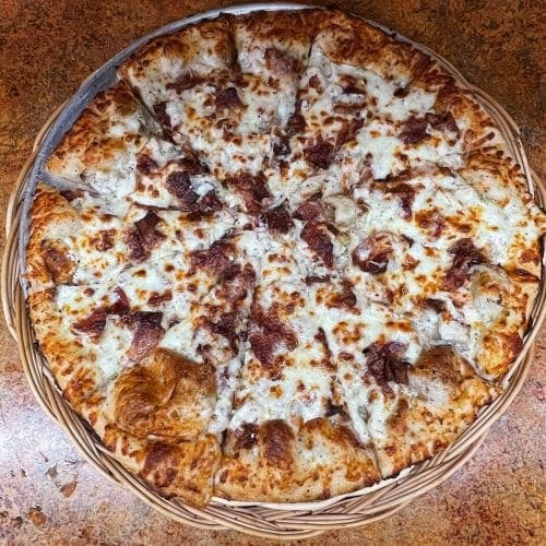 CHICKEN BACON RANCH - Our homemade dough lightly covered with white sauce, smothered with ranch dressing, topped with chicken, bacon, and mozzarella cheese.